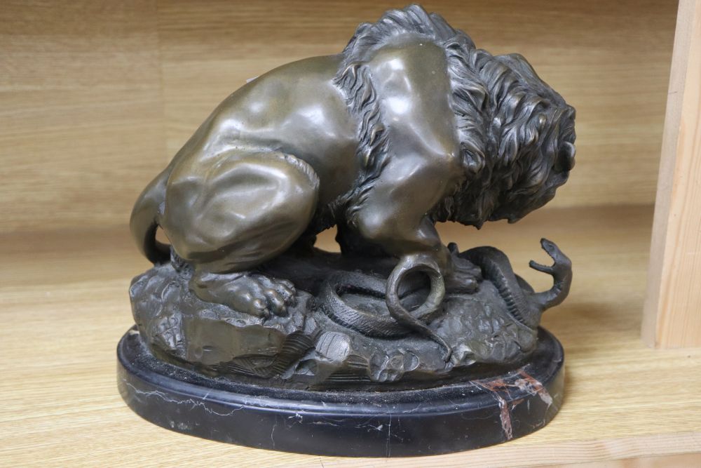 After A. Barye. A bronze of lion and a snake, height 24cm